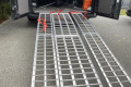 Loading ramps resting on vehicle 
