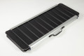 Folded black wheelchair ramp with carry handle
