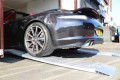 Car driving in to a showroom 