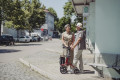 Red rollator on the street 