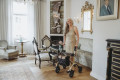 Carbon fibre rollator in use 