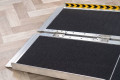Wheelchair ramp hinge 