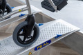 Pair of lightweight wheelchair ramps resting on step 