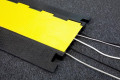 Cable protector protecting cables on carpet 