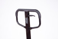 Black handle of the hand operated pallet truck with instructions 