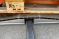 Aluminium bridge ramp resting over obstacle 