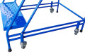 Close-up of the ladders punched metal tread surface and wheels