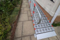 RollAble ramp with handrail providing access into a home 