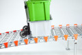Trolley going up rollable ramp with support legs 
