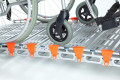 Manual wheelchair on the aluminium rollable ramp 