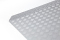 Raised edge of folding drive in ramp 