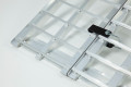 Brackets connecting two loading ramps 