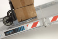 Close up of trolley on folding van ramp 