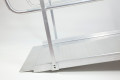Side view of wheelchair ramp with handrails 