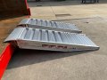Side view of a pair of  aluminium container ramps 