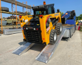 Mustang plant machinery on loading ramps 