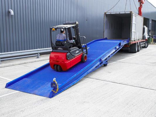 Forklift driving up yard ramp 
