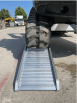 Rubber tracked digger on ramp 