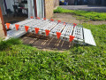 side profile of rollable ramp going up and over into a pvc front door