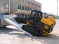 Loader on loading ramps 