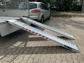 heavy duty loading ramps resting on trailer 