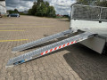 plant machinery loading ramps on trailer 