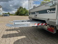 Aluminium loading ramps on trailer stored 