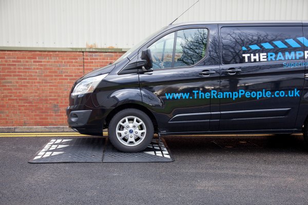 The Ramp People pass over the speed cushion 