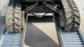 Close up of rubber tracks on ramps 