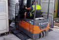 Forklift on rubber container ramp 