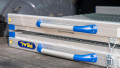 Close up of a folding feal anyramp folded up in the boot of a car