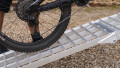 Push bike being pushed up our extra wide motorcycle loading ramps