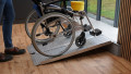 Manual wheelchair going up a portable alumium wheelchair ramp 