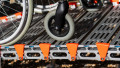 Close up of rollable ramp grip surface with wheelchair being loaded