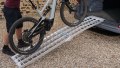 Push bike being pushed up our single extra wide motorcycle loading ramp
