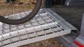 Push bike being pushed up our extra wide motorcycle loading ramp kit - close up of the rest on connection