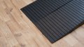Pair of rubber threshold ramps with an anti-slip surface 
