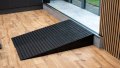 pair of rubber threshold ramps used to overcome step in home 