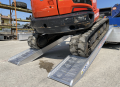 digger driving up ramps 