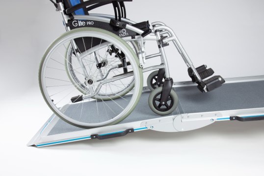 Manual wheelchair going up the broadfold ramp 