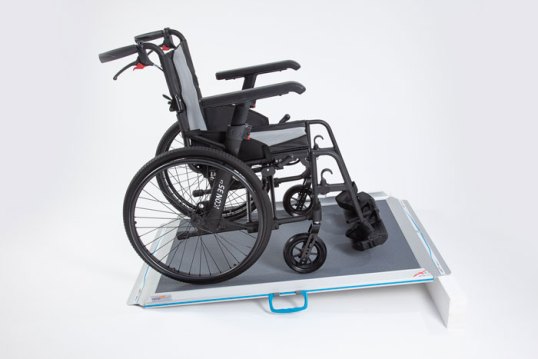 Wheelchair going up Aerolight Classic wheelchair ramp 