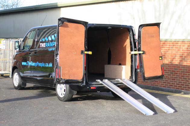 Aluminium channel ramps resting on a van 