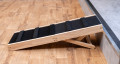 Wooden pet step set up in front of a step