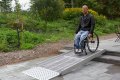 Person using modular wheelchair ramp 