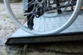 Wheelchair on fixed threshold ramp 