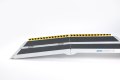 Multifold ramp on a white background with hazard tape