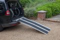 Multifold ramp resting on vehicle 