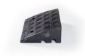 Side view of black rubber kerb ramp 