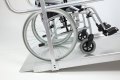Manual wheelchair going up wheenchair ramp 