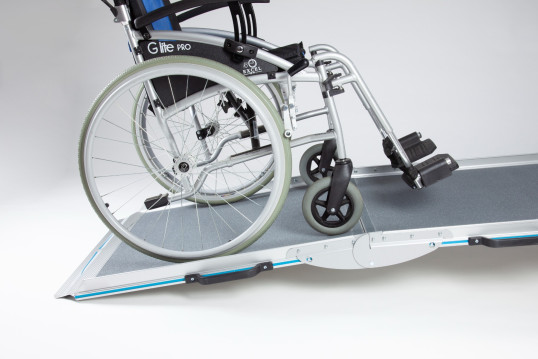 Manual wheelchair going up the broadfold ramp 